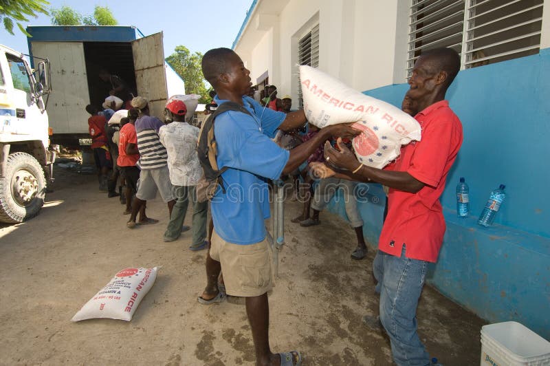 Volunteers help to unload food for a distribution to those affected by Hurricane Ike in Gonaives, Haiti. Volunteers help to unload food for a distribution to those affected by Hurricane Ike in Gonaives, Haiti.