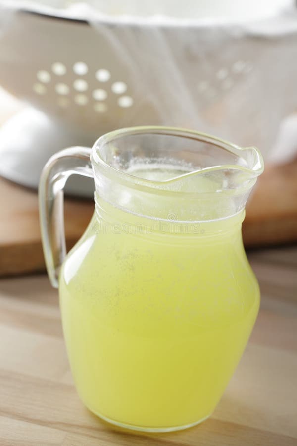 Jug with whey on the rustic table. Jug with whey on the rustic table