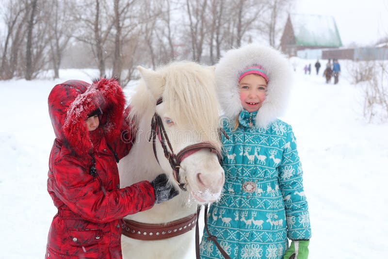 Children with the little horse. Children with the little horse