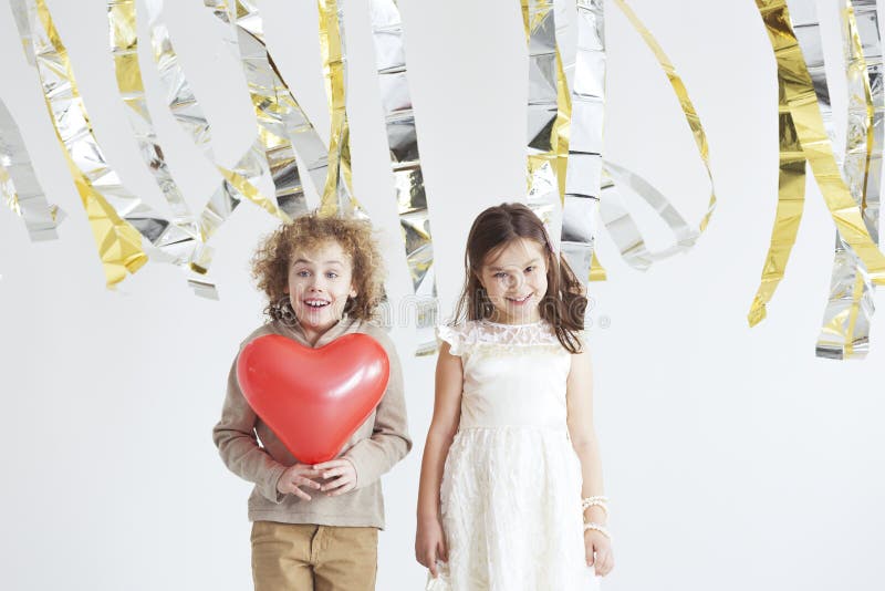 Kids enjoying Valentine`s Day, boy holding red heart. Kids enjoying Valentine`s Day, boy holding red heart