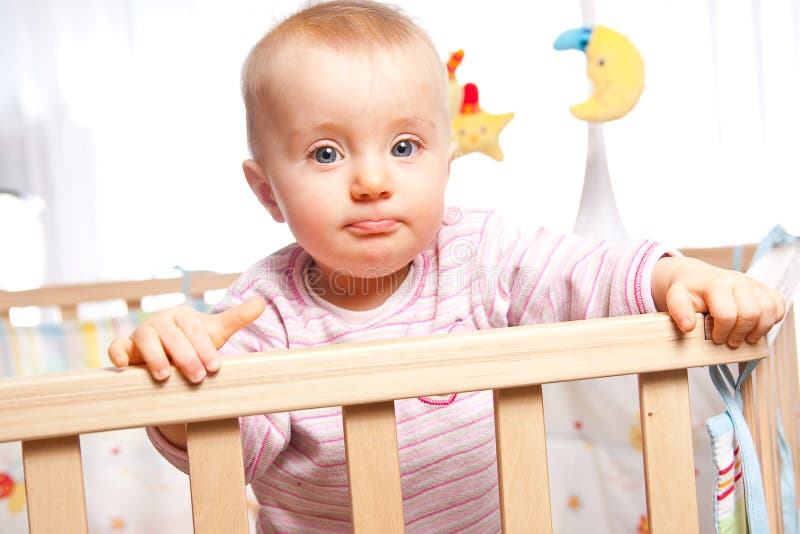 Sulking baby in the playpen. Sulking baby in the playpen