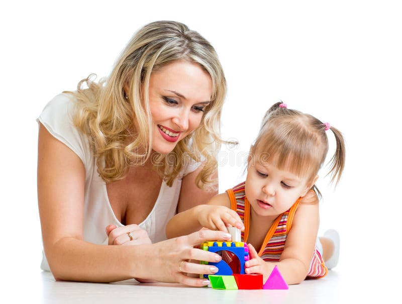 Child girl and mother playing together with puzzle toy. Child girl and mother playing together with puzzle toy