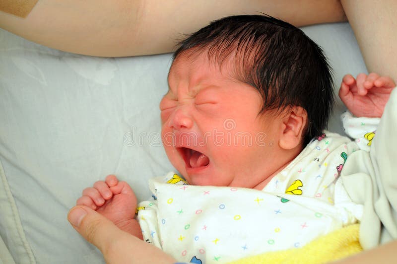 A Newborn Asian baby boy crying. A Newborn Asian baby boy crying