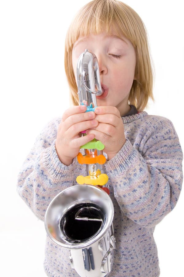 Child playing music on instrument. boy practicing saxophone isolated on white. kid with toy plastic sax. Child playing music on instrument. boy practicing saxophone isolated on white. kid with toy plastic sax