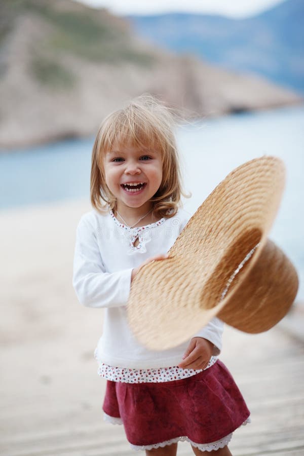 Happy child near sea on berth. Happy child near sea on berth