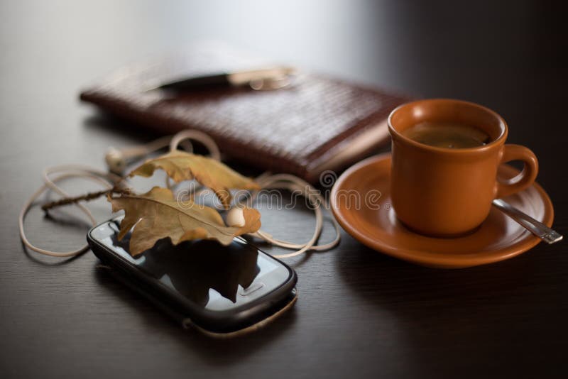 Autumn concept with diary, mobile phone and coffee. Autumn concept with diary, mobile phone and coffee