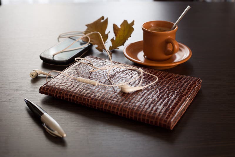 Autumn concept with diary, mobile phone and coffee. Autumn concept with diary, mobile phone and coffee