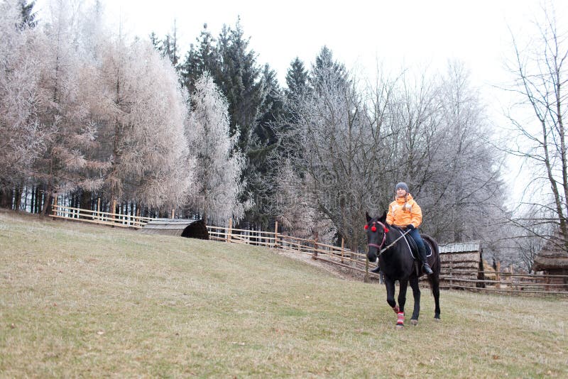 Girl riding her horse at countryside outdoors. Girl riding her horse at countryside outdoors