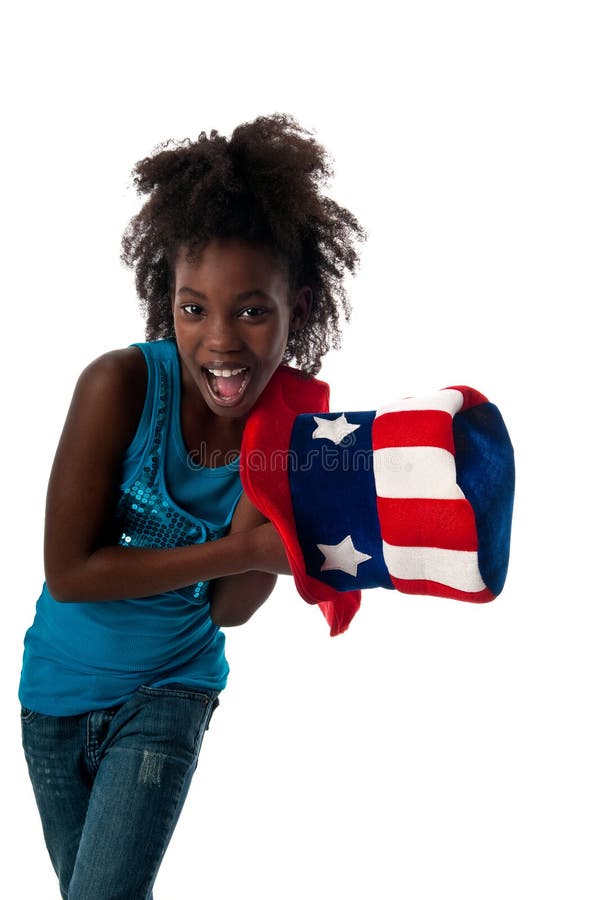 Little african american girl playing with american cap very happy. Little african american girl playing with american cap very happy.