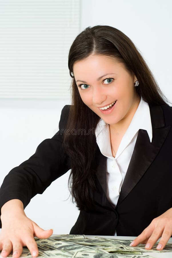 Nice girl in a business suit and money. Nice girl in a business suit and money