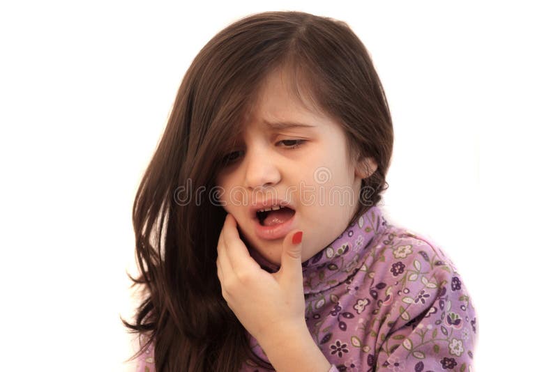 Cute little girl with her hand held to her face with painful expression showing toothache. Cute little girl with her hand held to her face with painful expression showing toothache