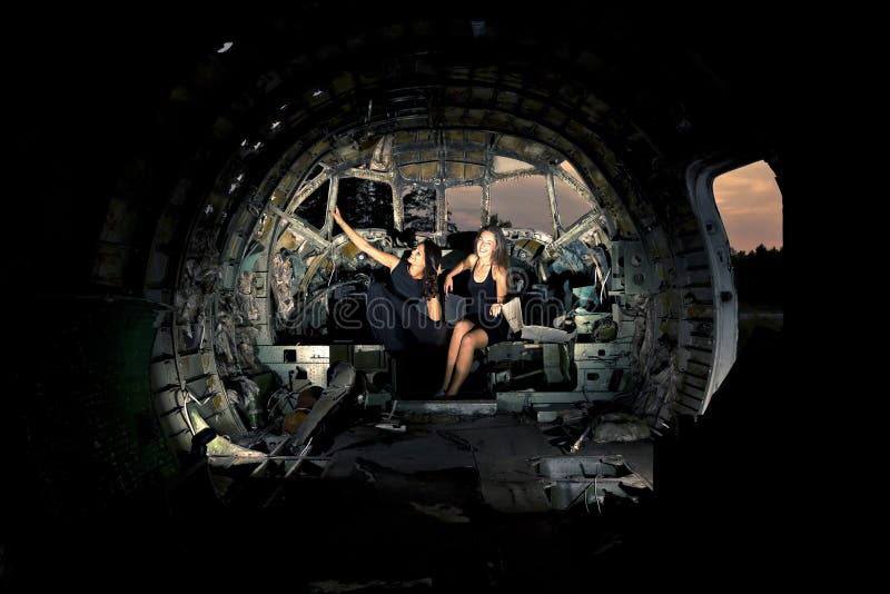 Girls in the the ruined airplane. Girls in the the ruined airplane