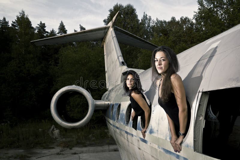 Girls in the ruined airplane. Girls in the ruined airplane