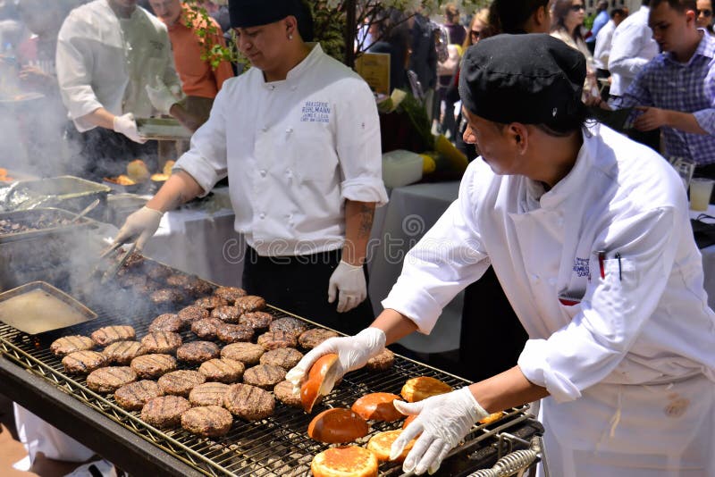 Jaime E. Loja, Chef de Cuisine (left) and his assistant Romeo, from Ruhlmann Brasserie, preparing delicious hamburgers during the 2012 Restaurant Days event at Rockefeller Center, New York. Jaime E. Loja, Chef de Cuisine (left) and his assistant Romeo, from Ruhlmann Brasserie, preparing delicious hamburgers during the 2012 Restaurant Days event at Rockefeller Center, New York