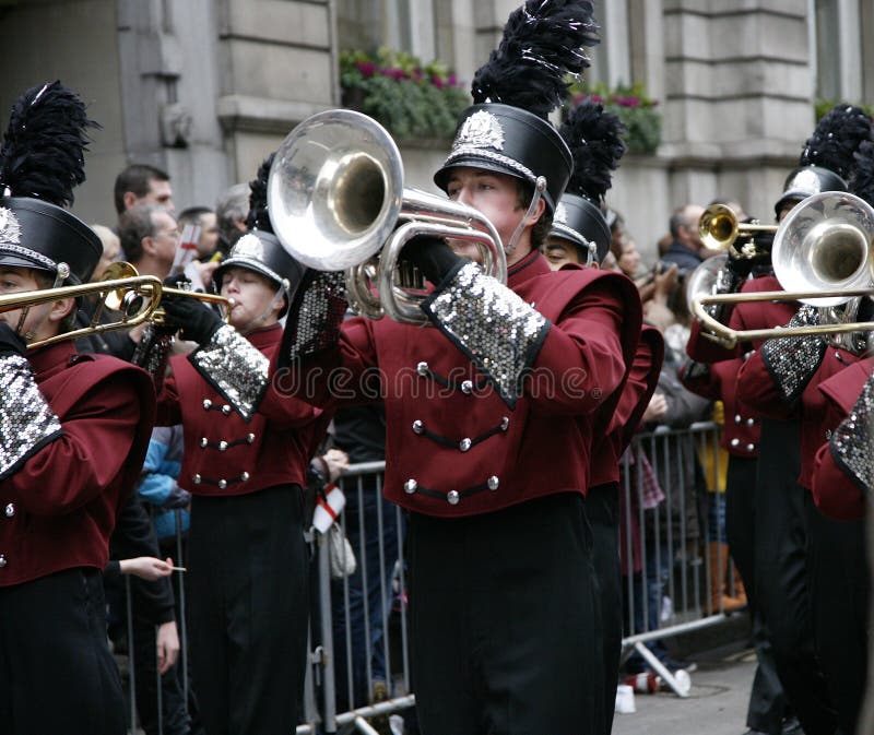 London, UK - January 01, 2012: Marching Band participate in the New Years Day Parade. More than 10,000 performers represent for 20 countries world-wide like marching bands, cheerleaders, clowns acrobats etc. London, UK - January 01, 2012: Marching Band participate in the New Years Day Parade. More than 10,000 performers represent for 20 countries world-wide like marching bands, cheerleaders, clowns acrobats etc.