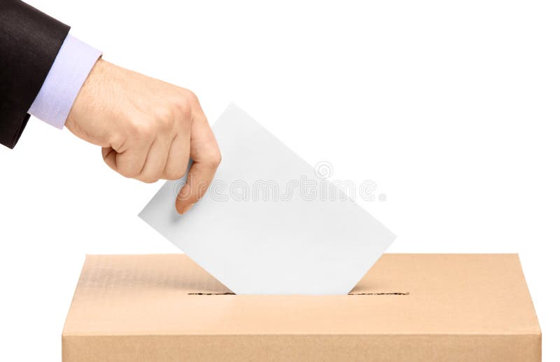 Dé poner una balota de votación en una ranura del rectángulo foto de archivo Dé poner una balota de votación en una ranura del rectángulo foto de archivo