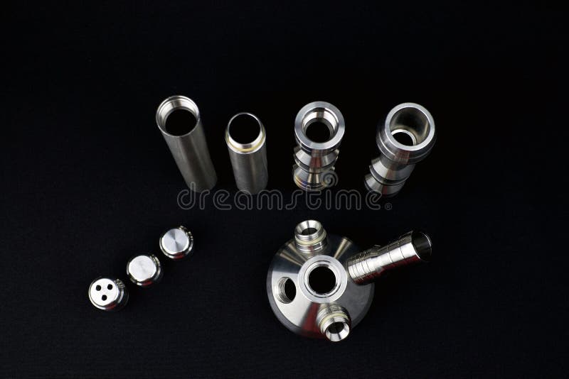 Disassemble hookah shaft made of stainless steel. Various components of the hookah shaft, top view. Disassemble hookah shaft made of stainless steel. Various components of the hookah shaft, top view