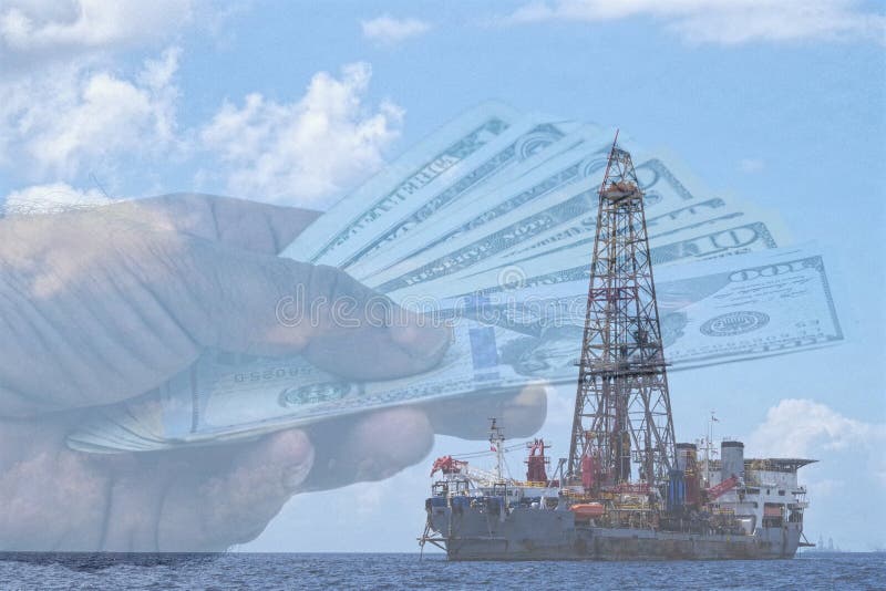 Increase of oil barrel, professionals planned a return on 100 usd per barrel for 2019. Picture showing oil offshore installation and US dollars in a background. Increase of oil barrel, professionals planned a return on 100 usd per barrel for 2019. Picture showing oil offshore installation and US dollars in a background.