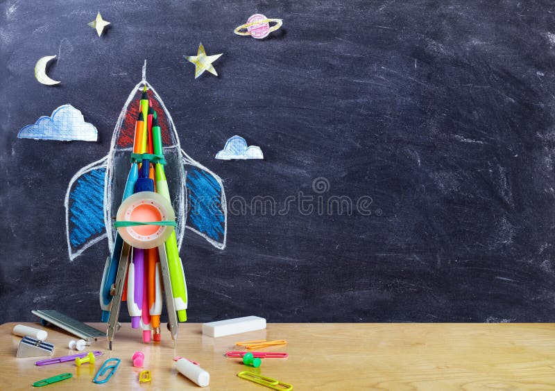 Startup - Rocket Drawing With School Supplies On Table. Startup - Rocket Drawing With School Supplies On Table