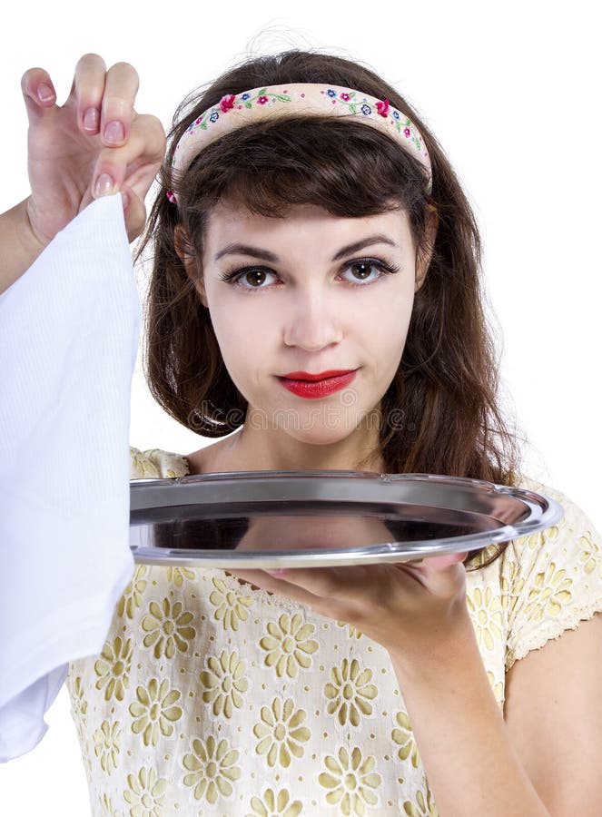 Retro style female waitress unveiling a surprise hidden in a tray and napkin. Retro style female waitress unveiling a surprise hidden in a tray and napkin