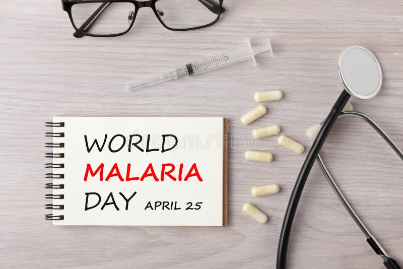Día de la malaria del mundo escrito en concepto del cuaderno imágenes de archivo libres de regalías Día de la malaria del mundo escrito en concepto del cuaderno imágenes de archivo libres de regalías