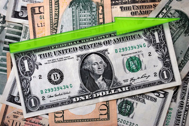 One american dollar and green arrow indicates growth on a pile of another american banknotes. One american dollar and green arrow indicates growth on a pile of another american banknotes