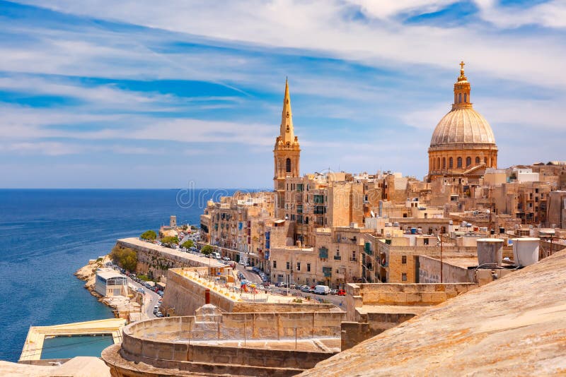 View from above of roofs and church of Our Lady of Mount Carmel and St. Paul`s Anglican Pro-Cathedral, Valletta, Capital city of Malta. View from above of roofs and church of Our Lady of Mount Carmel and St. Paul`s Anglican Pro-Cathedral, Valletta, Capital city of Malta