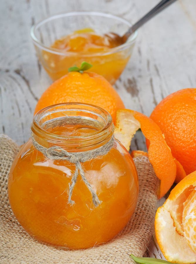 Orange jam on a wooden table. Orange jam on a wooden table