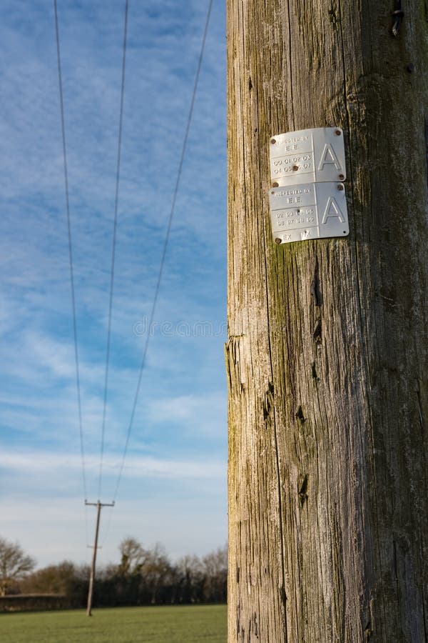 These old wooden poles, once used for telephone, are now used for supply commercial electrical feeds to remote locations. The distant pole can be seen to be leaning to one side, possible causing the cables to break and thus creating a power outage. These old wooden poles, once used for telephone, are now used for supply commercial electrical feeds to remote locations. The distant pole can be seen to be leaning to one side, possible causing the cables to break and thus creating a power outage.