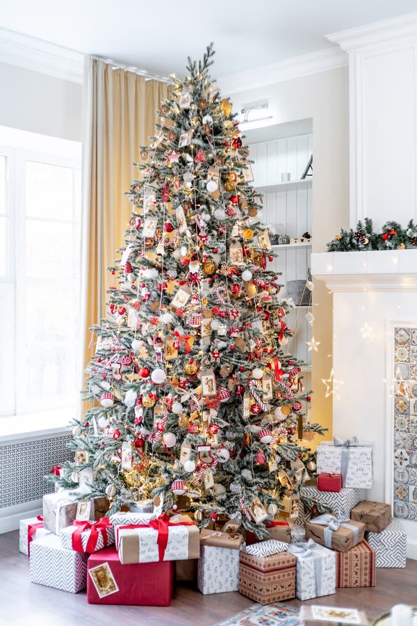 Christmas living room with a christmas tree and presents under it - modern classic style