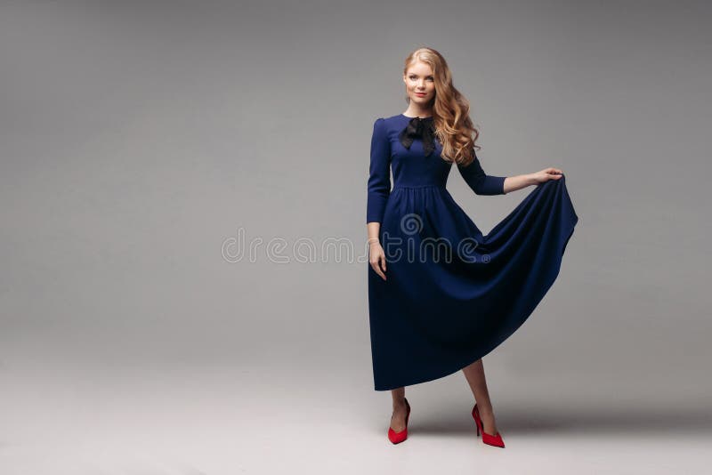 Stunning Slim Model in Bright Blue Dress and Black Heels. Fotografia