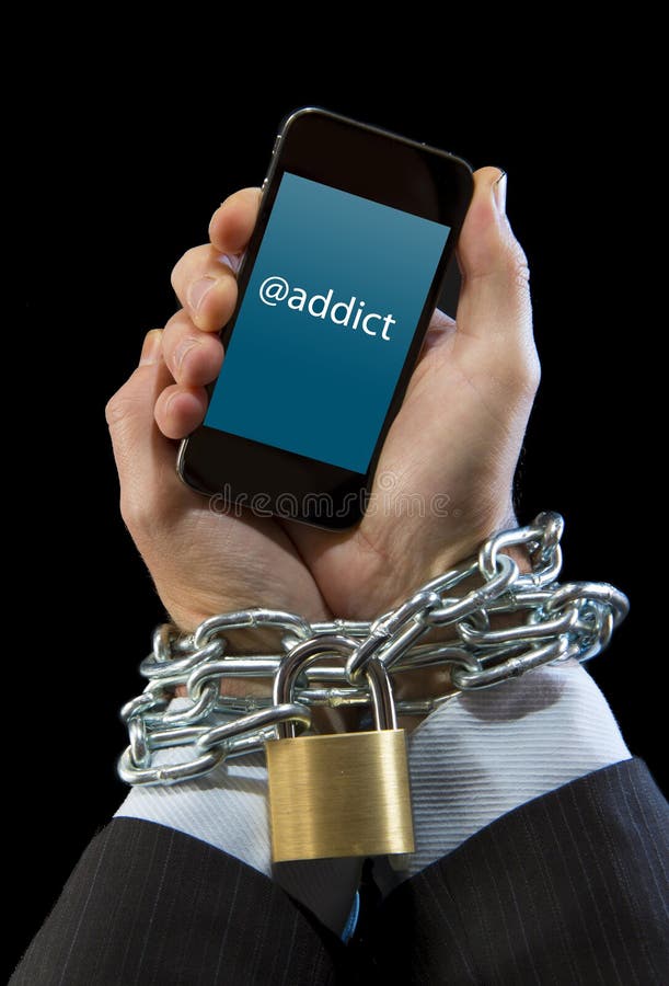 Hands of businessman addicted to mobile phone chain locked wrists in smartphone internet addiction and slave to online network addict concept isolated black background. Hands of businessman addicted to mobile phone chain locked wrists in smartphone internet addiction and slave to online network addict concept isolated black background