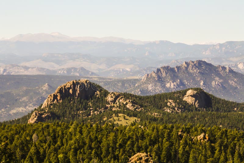 Devils head is a distinct granite rock outcropping in the front range west of Castle Rock. The outcropping is clearly visible from Castle Rock to Woodland Park. The outcropping is also home to the only fire lookout, in Colorado, that is staffed by the National Forest Service. This grants it a spot on the National Register of Historic Places. It should also have a spot on your hiking list. If you are in the front range it should be near the top. This hike does not offer you solitude or a particularly beautiful trail. It does offer you historical significance, views of 100 miles in all directions, and a whole lot of fun!! The hike to Devils head is perhaps the best in the area to take kids on. The majority of this hike is shaded by mixed Aspen and Pine forest. There are plenty of shaded benches where you can take a break to cool off, and catch your breath. A sign even marks the halfway point for you. The trail gains 950ft in elevation over 1.4 miles, and ends with a climb up 143 stairs. A person in average shape should easily be able to complete this hike.