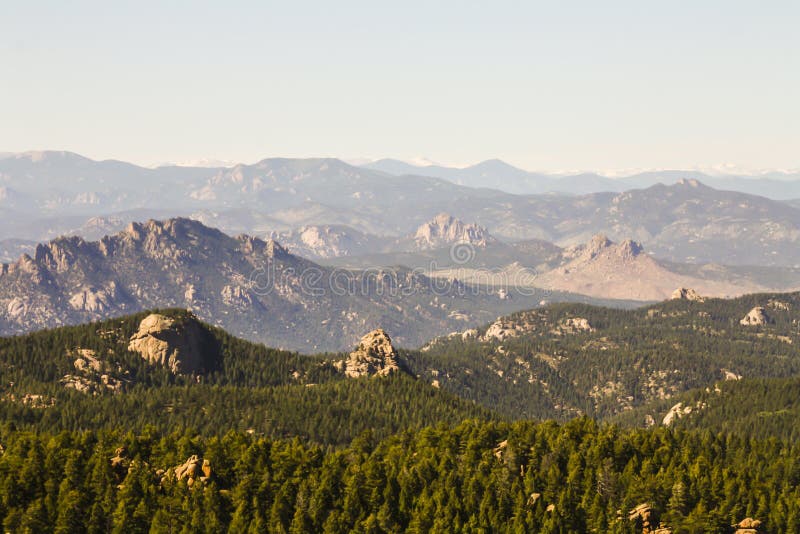 Devils head is a distinct granite rock outcropping in the front range west of Castle Rock. The outcropping is clearly visible from Castle Rock to Woodland Park. The outcropping is also home to the only fire lookout, in Colorado, that is staffed by the National Forest Service. This grants it a spot on the National Register of Historic Places. It should also have a spot on your hiking list. If you are in the front range it should be near the top. This hike does not offer you solitude or a particularly beautiful trail. It does offer you historical significance, views of 100 miles in all directions, and a whole lot of fun!! The hike to Devils head is perhaps the best in the area to take kids on. The majority of this hike is shaded by mixed Aspen and Pine forest. There are plenty of shaded benches where you can take a break to cool off, and catch your breath. A sign even marks the halfway point for you. The trail gains 950ft in elevation over 1.4 miles, and ends with a climb up 143 stairs. A person in average shape should easily be able to complete this hike.