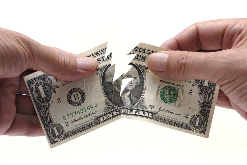 Dollar bill being torn in half by male hands. Dollar bill being torn in half by male hands