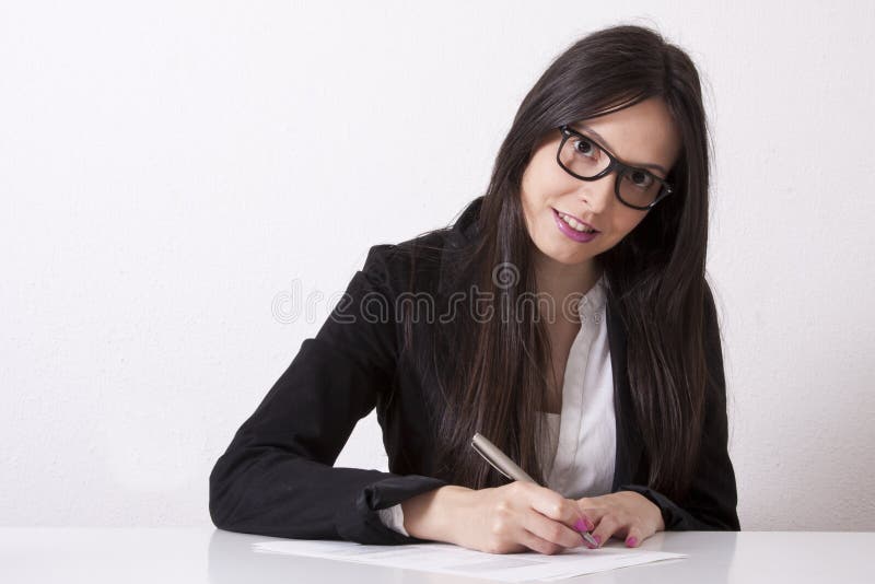 Donna d'affari che scrive immagini stock