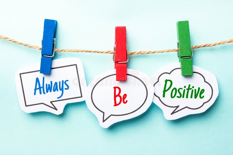 Paper speech bubbles with text Always Be Positive hanging on the line. Paper speech bubbles with text Always Be Positive hanging on the line.