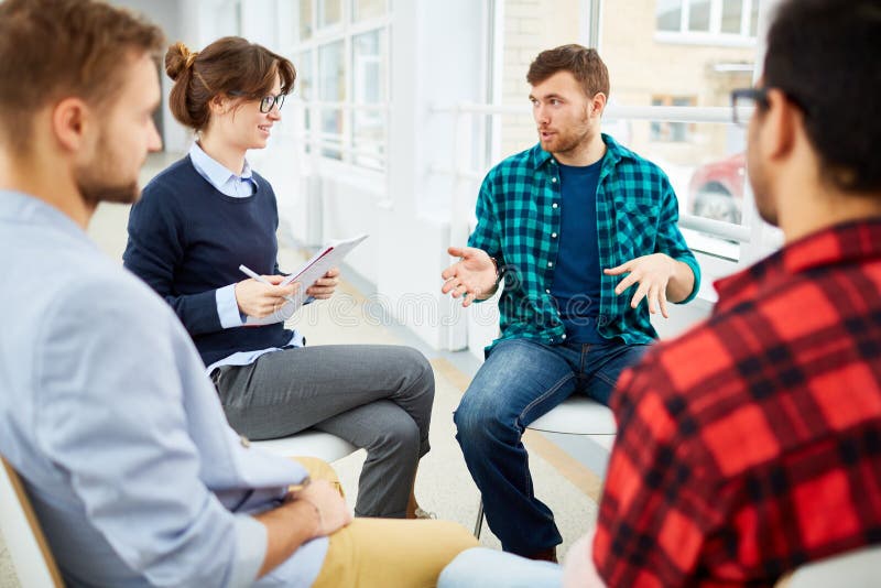 Circle of students practicing psychological therapy in group. Circle of students practicing psychological therapy in group