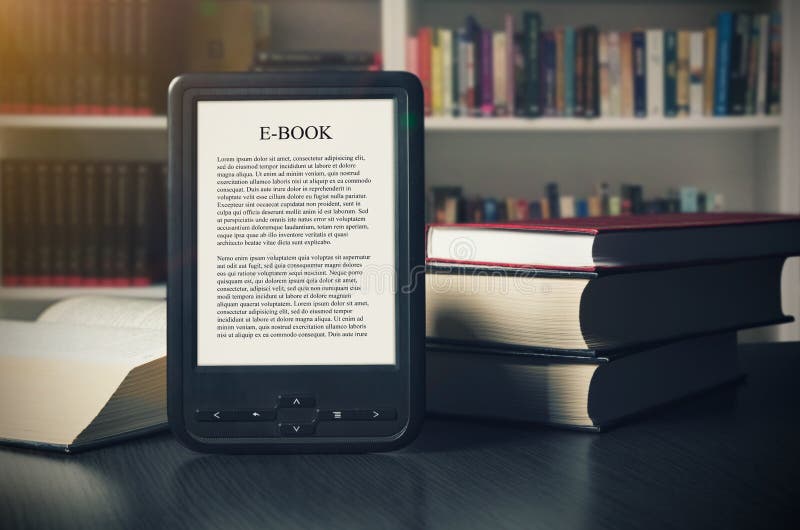 E-book reader device on desk in library stock photo