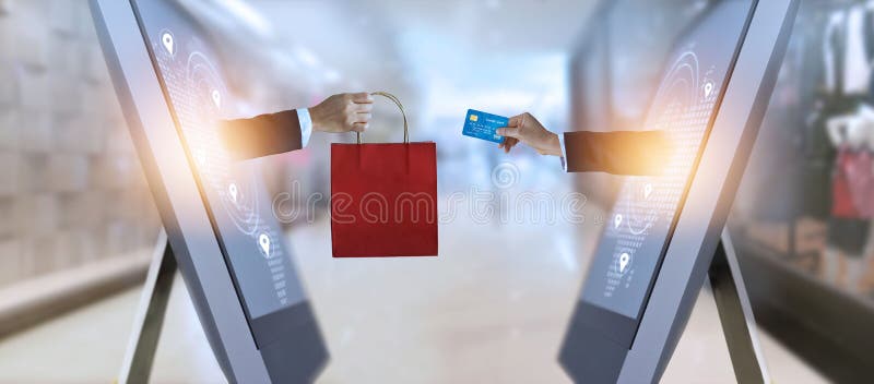 E-commerce, hand holding shopping bag and credit card from screen and global network, shopping and payments online concept royalty free stock image E-commerce, hand holding shopping bag and credit card from screen and global network, shopping and payments online concept royalty free stock image