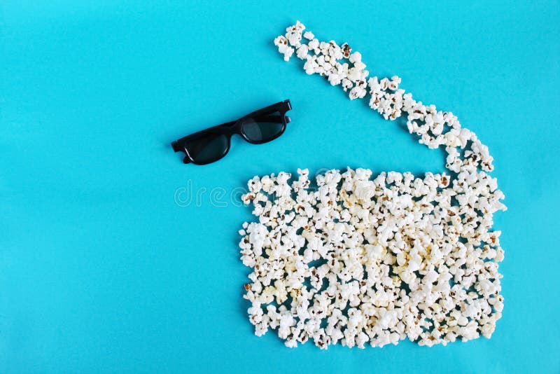 E Popcornfilmclapper och exponeringsglas 3d på blå bakgrund arkivfoton E Popcornfilmclapper och exponeringsglas 3d på blå bakgrund arkivfoton