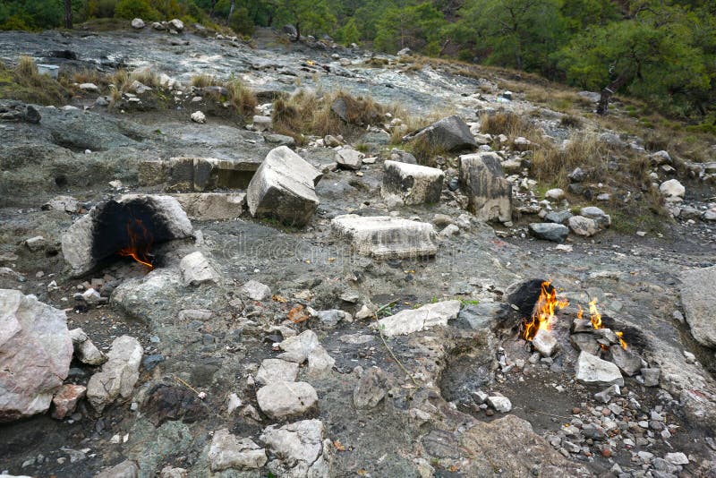 Cirali, Antalya/Turkey-January 01, 2018: Chimera, burning rocks are remarkable spot ot the trail of Lycian way near Cirali, Antalya. Cirali, Antalya/Turkey-January 01, 2018: Chimera, burning rocks are remarkable spot ot the trail of Lycian way near Cirali, Antalya