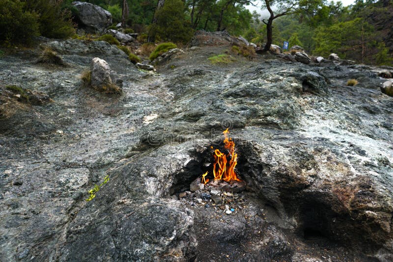 Cirali, Antalya/Turkey-January 01, 2018: Chimera, burning rocks are remarkable spot ot the trail of Lycian way near Cirali, Antalya. Cirali, Antalya/Turkey-January 01, 2018: Chimera, burning rocks are remarkable spot ot the trail of Lycian way near Cirali, Antalya