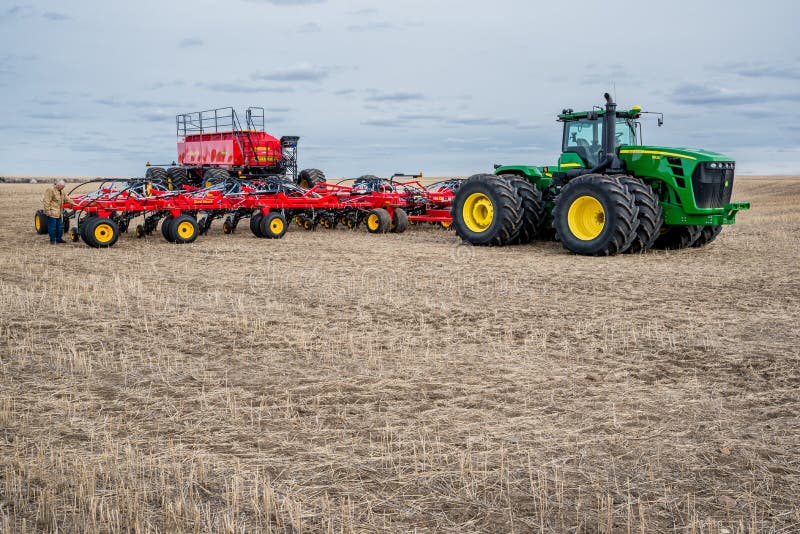 Swift Current, SK/Canada May 4, 2019 Farmer, Tractor and Air Drill