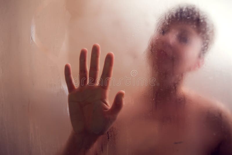 Woman`s Hand Held Up Against Steamed Glass. Palm on the moisture mirror. Woman`s Hand Held Up Against Steamed Glass. Palm on the moisture mirror