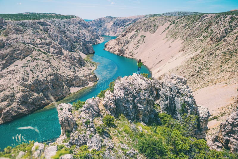 A woman travels to picturesque places in Croatia. R Il Croatia E E