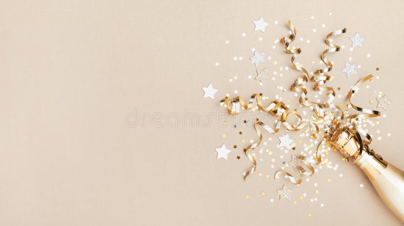 Celebration background with golden champagne bottle, confetti stars and party streamers. Christmas, birthday or wedding concept. Flat lay. Celebration background with golden champagne bottle, confetti stars and party streamers. Christmas, birthday or wedding concept. Flat lay