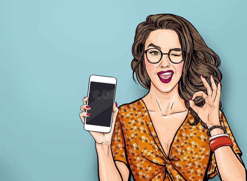 Wijająca kobieta w okularach, pokazująca inteligentny kamień i znak OK Dziewczyna z polem trzymająca telefon Model kobiecy reklam