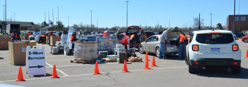 ANN ARBOR, MI - APRIL 26: Workers remove electronic equipment from cars at an electronic recycling event in Ann Arbor, MI April 26, 2014. ANN ARBOR, MI - APRIL 26: Workers remove electronic equipment from cars at an electronic recycling event in Ann Arbor, MI April 26, 2014.