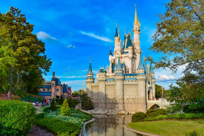 Orlando, Florida. March 19, 2019. Beatiful view of Cinderella`s castle on lightblue cloudy sky background in Magic Kingdom at Walt Disney World  1. Orlando, Florida. March 19, 2019. Beatiful view of Cinderella`s castle on lightblue cloudy sky background in Magic Kingdom at Walt Disney World  1